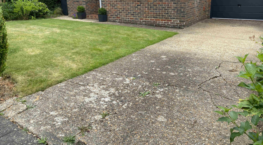 Before photo of front garden with concrete driveway and lawn